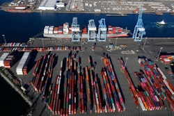 In this March 5, 2019, file photo, cargo containers are staged near cranes at the Port of Tacoma, in Tacoma, Wash. Most economists were already worried that the odds of a recession are rising, and most of the worries stem from the U.S.-China trade war.