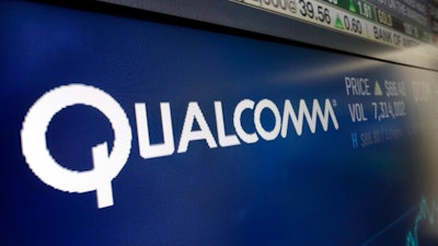 This Wednesday, Feb. 14, 2018 file photo shows the logo for Qualcomm on a screen at the Nasdaq MarketSite, in New York. A federal appeals court is temporarily protecting Qualcomm from an antitrust ruling that would have forced the mobile chipmaker to drastically change how it licenses key technology for connecting smartphones to the internet. Friday, Aug. 23, 2019 stay granted by the 9th U.S. Circuit Court of Appeals will prevent the Federal Trade Commission from enforcing key provisions of a lower court ruling that said Qualcomm abused its patents to stifle competition.