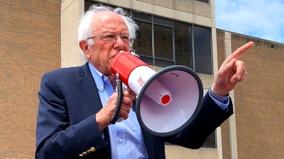 Democratic presidential candidate Bernie Sanders speaks to striking telecommunications workers on Sunday, Aug. 25, 2019, in Louisville, Ky. Sanders says it’s possible to be a friend of coal miners and a believer in climate change and the need for cleaner energy sources to combat it.