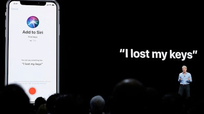 In this June 4, 2018, file photo Craig Federighi, Apple's senior vice president of Software Engineering, speaks about Siri during an announcement of new products at the Apple Worldwide Developers Conference in San Jose, Calif. Apple is apologizing and changing the way humans review audio recordings made through the company’s Siri digital assistant. The company already suspended the practice following the discovery that Apple and other major tech companies have been doing this.