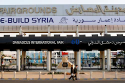 In this Oct. 2, 2018 file photo, Chinese visitors arrive to the opening of the Syria rebuilding exhibition, in Damascus, Syria. The U.S. Embassy in Syria on Wednesday, Aug. 28, 2019 posted a statement on Twitter that warned businesses from outside Syria against participating in an annual trade fare to be held in Damascus. It said anyone doing business with President Bashar Assad's government will expose themselves to the possibility of U.S. sanctions.