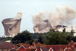 The cooling towers at the disused coal-fired Didcot power station in Oxfordshire, England are demolished Sunday, August 18, 2019.