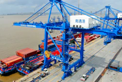 In this July 18, 2019, file photo, shipping containers are loaded onto a cargo ship at a port in Nantong in eastern China's Jiangsu province. Beijing appealed to Washington on Wednesday, Aug. 21, to 'meet China halfway' and end a tariff war after President Donald Trump said Americans might need to endure economic pain to achieve longer-term benefits.