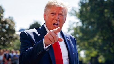 In this Aug. 9, 2019, photo, President Donald Trump talks to reporters on the South Lawn of the White House in Washington. Trump is showcasing the growing effort to capitalize on western Pennsylvania’s natural gas deposits by turning gas into plastics.