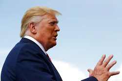 President Donald Trump speaks with reporters before boarding Air Force One at Morristown Municipal Airport in Morristown, N.J., Sunday, Aug. 18, 2019.