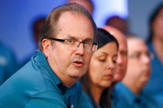 In this July 16, 2019, file photo, Gary Jones, United Auto Workers President, speaks during the opening of their contract talks with Fiat Chrysler Automobiles in Auburn Hills, Mich. On Wednesday, Aug. 28, 2019, an FBI spokesperson confirmed federal agents are searching Jones' suburban Detroit home apparently another step in an investigation of union corruption.