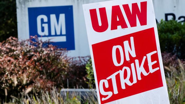 In this Sept. 23, 2019, file photo a sign is posted during a demonstration outside a General Motors facility in Langhorne, PA.