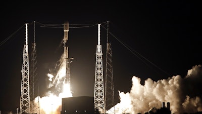 In this May 23, 2019, file photo, a Falcon 9 SpaceX rocket, with a payload of 60 satellites for SpaceX's Starlink broadband network, lifts off from Space Launch Complex 40 at the Cape Canaveral Air Force Station in Cape Canaveral, Fla. It’s a 21st century space race: Amazon, SpaceX and others competing to get into orbit and provide internet to the earth’s most remote places.
