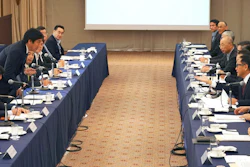 Akio Toyoda, center right, president and CEO of Toyota Motor Corp., with a group of the Japanese automakers chiefs, speaks to Japanese Trade Minister Isshu Sugawara, left standing, during a meeting Thursday in Tokyo.