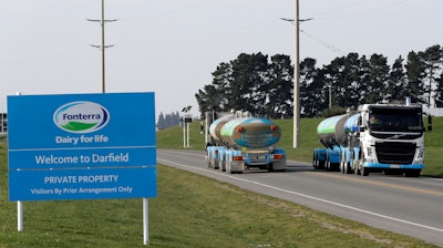 In this Sept. 12, 2018, file photo, Fonterra milk tankers pass each other outside the Darfield factory near Christchurch, New Zealand.