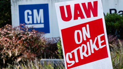 In this Sept. 23, 2019, file photo a sign is posted during a demonstration outside a General Motors facility in Langhorne, PA.