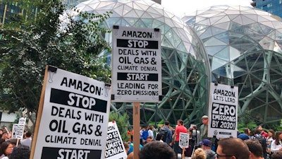 Amazon workers begin to gather in front of the Spheres, participating in the climate strike Friday, Sept. 20, 2019, in Seattle. A wave of climate change protests swept across the globe Friday, with hundreds of thousands of young people sending a message to leaders headed for a U.N. summit: The warming world can't wait for action.