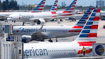 A former American Airlines mechanic who prosecutors say may have some links to terrorists is due to enter a plea to charges that he sabotaged an aircraft with 150 people aboard.