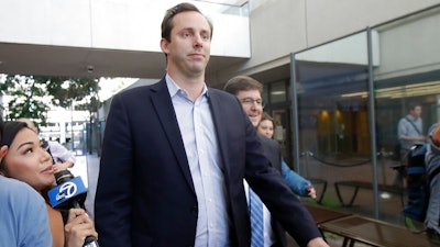 In this Aug. 27, 2019, file photo former Waymo employee Anthony Levandowski, center, leaves a federal courthouse in San Jose, Calif. A federal judge on Wednesday, Sept. 4, rejected a government recommendation that he impose a $10 million bail bond on Levandowski, a former Google engineer. Levandowski is accused of stealing self-driving car technology before joining Uber's effort to build robotic taxis for its ride-hailing service.