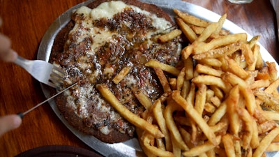 A dish at 'La Reverde' vegan restaurant in Buenos Aires, Argentina. A steak made with wheat gluten and ingredients including beet puree and spices help create a similar tone to beef.