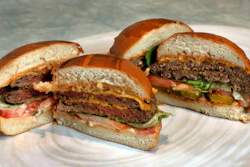 This file photo shows an Original Impossible Burger, left, and a Cali Burger, from Umami Burger, in New York.
