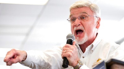In this March 11, 2018, file photo, Cecil Roberts, president of United Mine Workers of America, speaks at the Greene County Fairgrounds in Waynesburg, Pa. Roberts says plans by Democratic presidential candidates to address climate change must account for thousands of coal workers whose jobs are at risk because of mine closures and competition from cheaper natural gas.