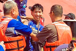 In this image released by the U.S. Coast Guard shows a crew member of the cargo ship Golden Ray as he is helped off the capsized ship Monday, Sept. 9, 2019 off St. Simons Island, Ga. A fire broke out aboard the ship early Sunday, listing it to the side and blocking the shipping channel.