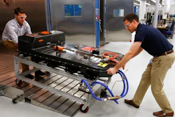 In this Nov. 4, 2016, file photo, a Chevrolet Bolt EV battery pack is removed for testing after undergoing charging and discharging cycles at General Motors Warren Technical Center's Advanced Energy Center in Warren, Mich. If U.S. consumers ever ditch fuel burners for electric vehicles, then the United Auto Workers union is in trouble. Gone would be thousands of jobs at engine and transmission plants across the industrial Midwest, replaced by smaller workforces at squeaky-clean mostly automated factories that mix up chemicals to make batteries.