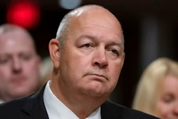 In this May 15, 2019, file photo Stephen M. Dickson, President Donald Trump's nominee to run the Federal Aviation Administration, appears before the Senate Committee on Commerce, Science, and Transportation for his confirmation hearing, on Capitol Hill in Washington. The new chief of the Federal Aviation Administration, Stephen Dickson has met with Boeing officials and tested new software for the 737 Max in a flight simulator, Thursday, Sept. 19, 2019. Dickson also toured the assembly line where workers keep building the Max even though it remains grounded after two crashes that killed 346 people. Dickson says his agency has no timetable for its review of changes that Boeing is making to the plane.