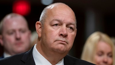 In this May 15, 2019, file photo Stephen M. Dickson, President Donald Trump's nominee to run the Federal Aviation Administration, appears before the Senate Committee on Commerce, Science, and Transportation for his confirmation hearing, on Capitol Hill in Washington. The new chief of the Federal Aviation Administration, Stephen Dickson has met with Boeing officials and tested new software for the 737 Max in a flight simulator, Thursday, Sept. 19, 2019. Dickson also toured the assembly line where workers keep building the Max even though it remains grounded after two crashes that killed 346 people. Dickson says his agency has no timetable for its review of changes that Boeing is making to the plane.