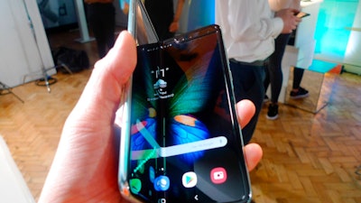 In this Tuesday April 16, 2019 file photo, the Samsung Galaxy Fold smartphone is presented during a media preview event in London. Samsung is hoping the innovation of smartphones with folding screens reinvigorates the market. Samsung says it will start selling its highly anticipated folding phone on Friday Sept. 6, 2019, after its original launch date was delayed by months because of embarrassing problems with the screen.