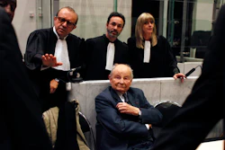 In this May 21, 2013 file photo, Jacques Servier, founder of Servier Laboratories, sits during the opening of the trial of the so-called Mediator case, a drug linked to hundreds of deaths, at Nanterre's court house, outside Paris. A massive trial with more than 4,000 plaintiffs is opening for French pharmaceutical giant Servier Laboratoires and France's medicines watchdog, accused of involuntary manslaughter, fraud and other charges in a scandal over a diabetes medication suspected of causing hundreds of deaths.