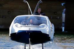 SeaBubbles co-founder Sweden's Anders Bringdal stands onboard a SeaBubble, Wednesday Sept. 18, 2019 in Paris. Paris is testing out a new form of travel - an eco-friendly bubble-shaped taxi that zips along the water, capable of whisking passengers up and down the Seine River. Dubbed Seabubbles, the vehicle is still in early stages, but proponents see it as a new model for the fast-changing landscape of urban mobility.