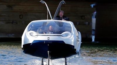 SeaBubbles co-founder Sweden's Anders Bringdal stands onboard a SeaBubble, Wednesday Sept. 18, 2019 in Paris. Paris is testing out a new form of travel - an eco-friendly bubble-shaped taxi that zips along the water, capable of whisking passengers up and down the Seine River. Dubbed Seabubbles, the vehicle is still in early stages, but proponents see it as a new model for the fast-changing landscape of urban mobility.