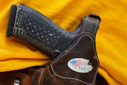 In this April 14, 2018 file photo, a man wears an unloaded pistol during a pro gun-rights rally in Austin, Texas. In a letter sent to the Senate on Thursday, Sept. 12, 2019, CEOs from businesses including Airbnb, Twitter and Uber asked Congress to pass a bill to require background checks on all gun sales and a strong red flag law that would allow courts to issue life-saving extreme risk protection orders.