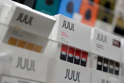 In this Dec. 20, 2018, file photo Juul products are displayed at a smoke shop in New York. Federal health authorities say vaping giant Juul Labs illegally promoted its electronic cigarettes as a safer option to smoking, including in a presentation to school children. The Food and Drug Administration issued a stern warning letter to the company Monday, Sept. 9, 2019, flagging various claims by Juul, including that its products are “much safer than cigarettes.” The FDA has been investigating Juul for months but had not previously warned the company.