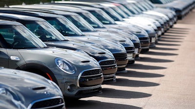 In this Aug. 25, 2019, file photo, a long line of unsold Clubman sports-utility vehicles sit at a Mini dealership in Highlands Ranch, Colo. On Friday, Sept. 13, the Commerce Department releases U.S. retail sales data for August.