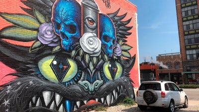 This photo shows a mural painted Jeff Soto and Maxx Gramajo in Detroit.