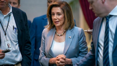 Speaker of the House Nancy Pelosi, D-Calif., arrives for a closed-door meeting with the House Democratic Caucus, Wednesday, Sept. 18, 2019, at the Capitol in Washington.