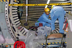 In this Nov. 28, 2018, photo, workers dismantle the Unit 2 reactor at Chubu Electric Power Co.,'s Hamaoka nuclear power plant in Omaezaki, Shizuoka prefecture. Japan's nuclear policy-setting body has adopted a report saying the country is entering an era of massive nuclear plant decommissioning, urging operators to plan ahead to lower safety risks and costs on work requiring decades and billions of dollars.