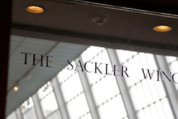 In this Jan. 17, 2019, file photo, a sign with the Sackler name is displayed at the Metropolitan Museum of Art in New York. Their name used to be on a wing at the Louvre. But now the Sackler family wealth has become linked to sales of OxyContin, and their company, drug maker Purdue Pharma, is attempting to settle lawsuits over the opioid crisis.