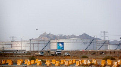 Storage tanks are seen at the North Jiddah bulk plant, an Aramco oil facility, in Jiddah, Saudi Arabia, Sunday, Sept. 15, 2019. The weekend drone attack in Buqyaq on one of the world's largest crude oil processing plants that dramatically cut into global oil supplies is the most visible sign yet of how Aramco's stability and security is directly linked to that of its owner -- the Saudi government and its ruling family.