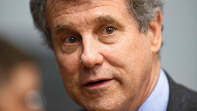In this March 3, 2019 file photo, Sen. Sherrod Brown, D-Ohio, speaks to reporters during the Martin Luther and Coretta Scott King Unity Breakfast in Selma, Ala. Brown is rolling out a proposal that would force employers to warn workers and retrain them when their jobs are about to be eliminated by automation.