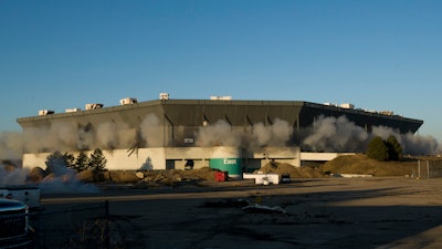 In this December 3, 2017 file photo, detonations can be seen during an attempted implosion of the Silverdome, in Pontiac, Michigan. Online retail giant Amazon has proposed using the site of the former home of the Detroit Lions as a distribution center.