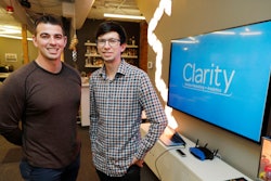 In this Tuesday, Sept. 10, 2019, photo Shane Griffiths, right, and Trenton Erker, left, co-owners of the digital marketing company Clarity Online, pose for a photo in Seattle. Griffiths and Erker use technology for tasks like billing, scheduling appointments, tracking the time they spend on clients' projects and putting together reports on visits to client websites, as well as using freelancers for other tasks as ways to save money on employment costs, and also have more flexibility when they need specific talents or expertise for a project.
