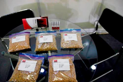 In this April 12, 2018, file photo, packets of raw soybeans are placed on a table at a U.S. soybean company's booth at the international soybean exhibition in Shanghai, China. China has announced some U.S. industrial chemicals will be exempt from tariff hikes imposed in a trade war with Washington but maintained penalties on soybeans, pork and other farm goods. The Ministry of Finance's announcement Wednesday, Sept. 11, 2019 came ahead of October talks aimed at ending the fight over trade and technology that threatens global economic growth.
