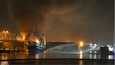 A Russian trawler with an ammonia tank and some 200,000 liters of diesel oil inside is in flames at a northern Norwegian port and authorities have evacuated surrounding areas due to an explosion risk.
