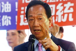 In this June 21, 2019, file photo, Terry Gou, chairman of Foxconn, the world's largest contract assembler of consumer electronics, speaks to the media after the company's annual shareholders meeting in New Taipei City, Taiwan.