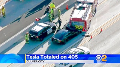 This Jan. 22, 2018, file still frame from video provided by KCBS-TV shows a Tesla Model S electric car that has crashed into a fire engine on Interstate 405 in Culver City, Calif. A government report says the driver of the Tesla that slammed into a firetruck was using the car’s Autopilot system when a vehicle in front of him suddenly changed lanes and he didn’t have time to react. The National Transportation Safety Board said Tuesday, Sept. 3, 2019, that the driver never saw the parked firetruck and didn’t brake.