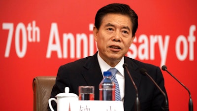 Chinese Commerce Minister Zhong Shan speaks during a press conference on the sidelines of the upcoming 70th anniversary of the Founding of the People's Republic of China in Beijing on Sunday, Sept. 29, 2019.