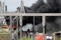 Plant workers watch a transformer fire as the Texas City Fire Department responds at the Ashland chemical plant on Tuesday, Sept. 17, 2019. There have been no reported injuries and there are no threats to the community.