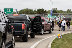 Protesting union members prevent cars from driving into the General Motors Flint Assembly Plant on Bristol Road as United Automobile Workers remain on strike against GM.
