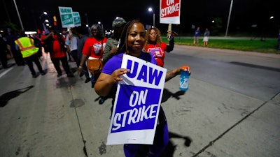 United Auto Workers members picket outside the General Motors Detroit-Hamtramck assembly plant in Hamtramck, Mich., early Monday, Sept. 16, 2019. Roughly 49,000 workers at General Motors plants in the U.S. planned to strike just before midnight Sunday, but talks between the UAW and the automaker will resume.