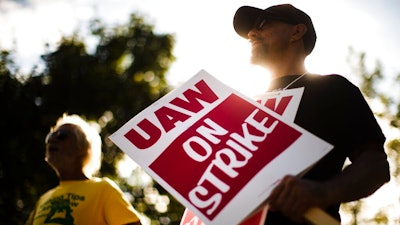 In this Sept. 16, 2019 file photo, union members picket outside a General Motors facility in Langhorne, Pa. The strike against GM by United Auto Workers entered its second week Monday, Sept. 23 with progress reported in negotiations but no clear end in sight. Bargainers met all weekend and returned to talks Monday morning as the strike entered its eighth day.