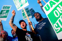 General Motors employees Bobby Caughel, left, and Flint resident James Crump, shout out as they protest with other GM employees, United Auto Workers members and labor supporters outside of the Flint Assembly Plant on Monday, Sept. 16, 2019 in Flint, Mich. Thousands of members of the United Auto Workers walked off General Motors factory floors or set up picket lines early Monday as contract talks with the company deteriorated into a strike.